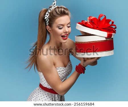 Young happy excited woman open gift box. Holidays, holiday, celebration, birthday and happiness concept