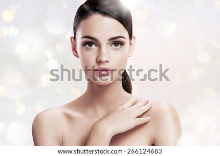 Pretty young woman with professional make-up, skin care concept