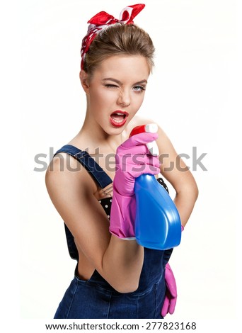 Beautiful cleaning girl wearing pink rubber protective gloves holding spray / young beautiful American pin-up girl isolated on white background. Cleaning service concept