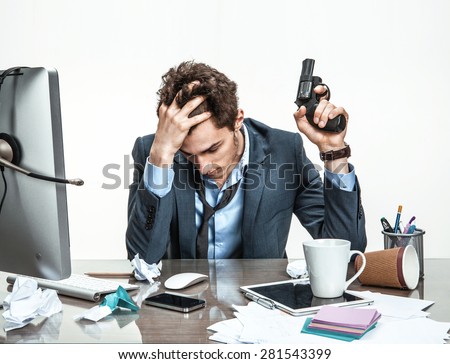 Manager with gun wants to commit suicide  / modern office man at working place, depression and crisis concept