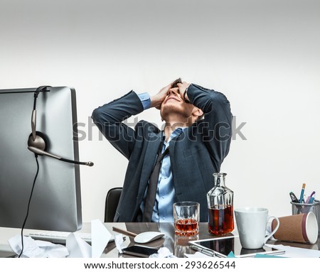 Oh my good, stressed businessman is taken for the head / modern office man at working place, depression and crisis concept