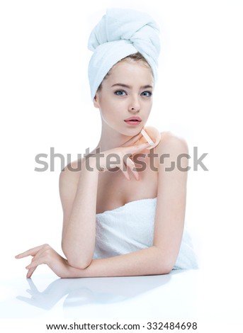 Pretty young girl enjoy a flawless skin, skin care concept / photo composition of blonde girl in towel - isolated on white background