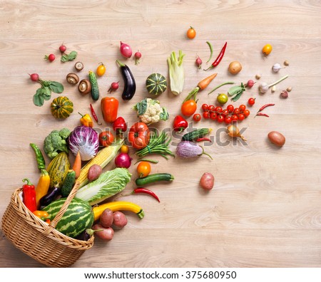 Healthy food background / studio photography of different fruits and vegetables on wooden table