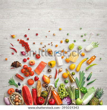 Organic food background. Studio photo of different fruits and vegetables on white wooden table. High resolution product.