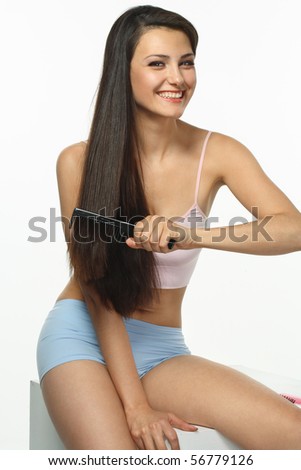 http://image.shutterstock.com/display_pic_with_logo/584005/584005,1278606030,2/stock-photo-daily-care-of-long-hair-the-girl-combs-beautiful-chestnut-hair-and-smiles-in-the-morning-56779126.jpg