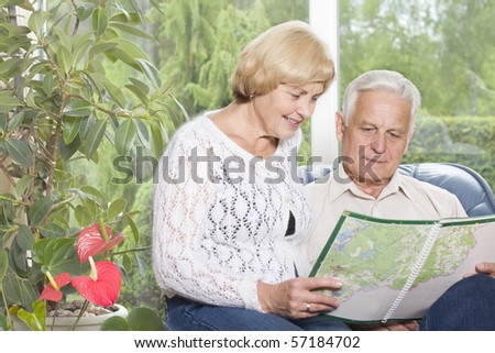 Romantic old couple planning a trip together