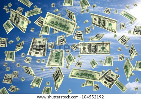 hundred dollar bills flying in the air