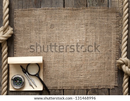 Old wooden planks and rope with compass vintage background concept