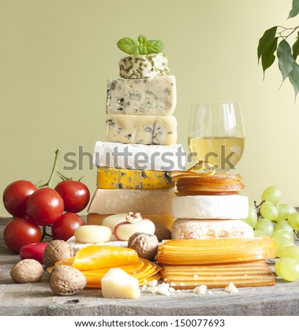 Pile Of Cheese Many Various Types With Wine Grapes And Walnuts