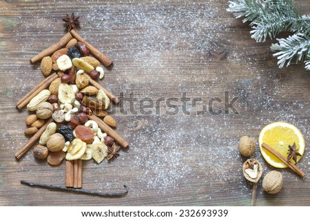 Christmas tree with dried fruits and nuts abstract background