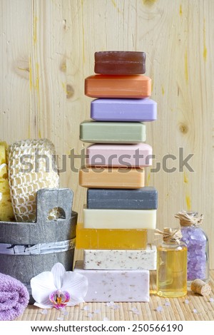 Pile of soaps with cosmetics for spa and body care