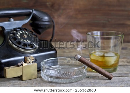 Cigar and whiskey abstract retro still life with telephone
