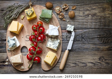 Various types of cheese on abstract vintage paint palette