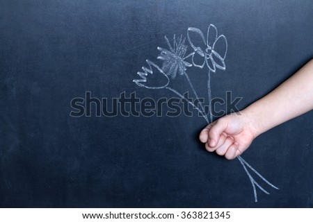 Flowers and child\'s hand abstract background concept