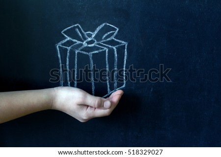 Present and child's hand abstract background concept