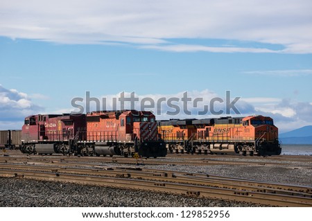DELTA, BC, CANADA - FEBRUARY 16, 2013: Two locomotives on standby at Deltaport freight yard in Delta on February 16, 2013. Deltaport is Port Metro Vancouver\'s largest container terminal.