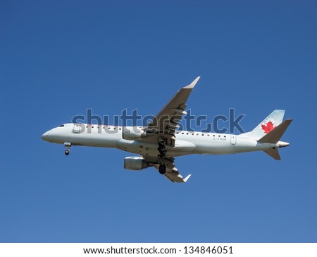 VANCOUVER, CANADA - MARCH 28: Air Canada Embraer 190 aircraft on final approach to Vancouver International Airport on March 28, 2013. Air Canada is the largest airline company in Canada.