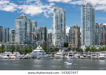 VANCOUVER, CANADA - June 13, 2013: People enjoy sunny day in Yaletown on June 13, 2013. Formerly a warehouse district, Yaletown is one of the most densely populated neighborhoods in the city.