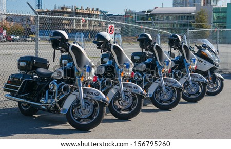 VANCOUVER, CANADA - SEPTEMBER 26, 2013: Vancouver Police Motorcycles are parked on Vancouver street on September 26, 2013. The Vancouver Police Department celebrated its 125th anniversary in 2011.