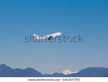 VANCOUVER, CANADA - DECEMBER 06, 2013: Air Canada aircraft takes off in Vancouver International Airport December 06, 2013. Air Canada is the largest airline company in Canada.