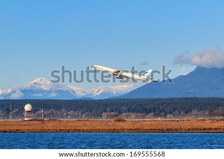 VANCOUVER, CANADA - JANUARY 03, 2014: Cathay Pacific airplane takes off in Vancouver International Airport. Cathay Pacific is the international flag carrier of Hong Kong.