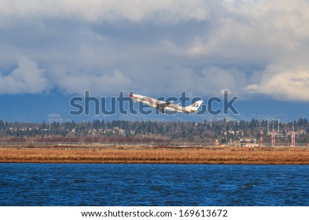 VANCOUVER, CANADA - JANUARY 03, 2014: China Eastern airplane takes off in Vancouver International Airport. China Eastern Airlines is China\'s second-largest carrier by passenger numbers.