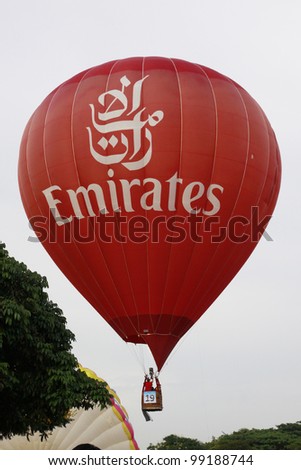 PUTRAJAYA-MARCH 18: Frank Wecther (USA) with Fly Emirates balloon at the 4th Putrajaya International Hot Air Balloon Fiesta on March 18, 2012 in Putrajaya, Malaysia.