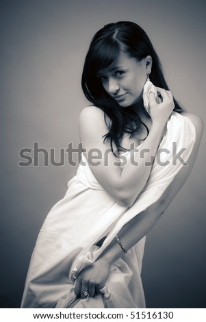 The young girl in a white bed-sheet