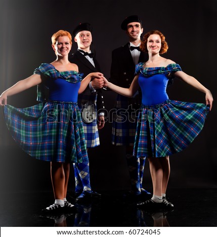 Two pair dancing the Scottish dance in a kilt