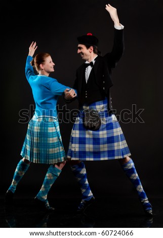 The pair dancing the Scottish dance in a kilt