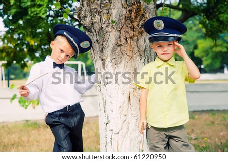 Portrait of two little boys in peak-caps