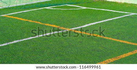 Green synthetic grass sports field backgroubd