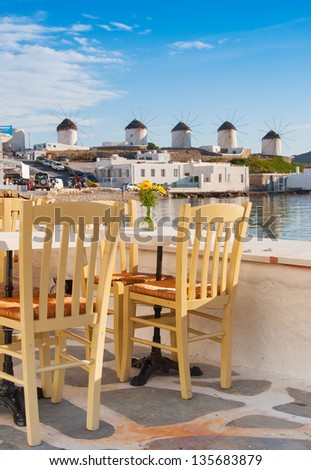 View of the famous windmills of Mykonos from cafe at Little Venice. Greece.