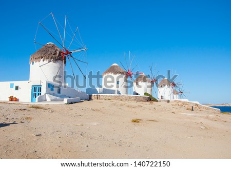 Windmills on a hill near the sea on the island of Mykonos