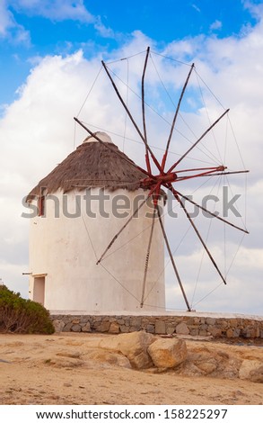 Windmill on a hill near the sea on the island of Mykonos - a place that must attend