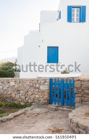 White and blue colors in the Greek architecture. Classic home on the islands in Greece ...