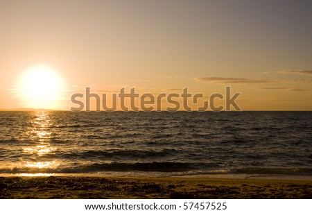 An orange sunset in the blue sea and the sun!  background!!!