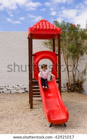 The little girl on the slide at the site...