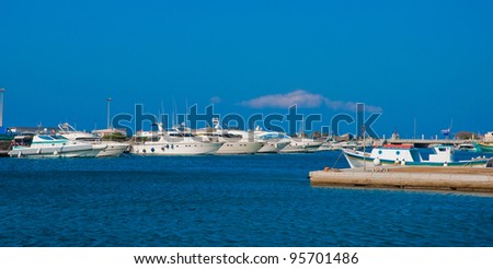 Pleasure boats at the port of the European island.