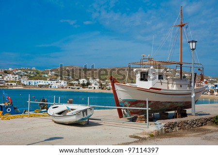 Preparation of a fishing boat for the season and fishing in the sea at the port of the Greek islands.