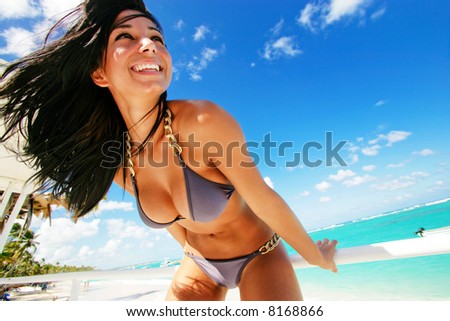 stock photo fun playful brunette swimsuit model on vacation