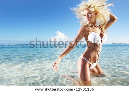 stock photo Beautiful blonde swimsuit model having fun on vacation