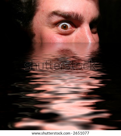 Scary Face coming out of dark water