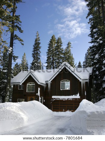 Winter cabin covered with fresh snow