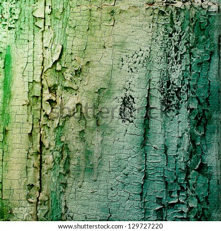 Old wooden planks painted with green paint rustic background, paint peeling