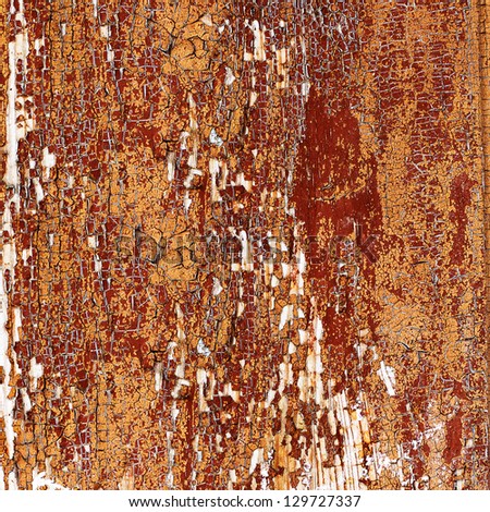 Old wooden planks brown paint cracked by a rustic background