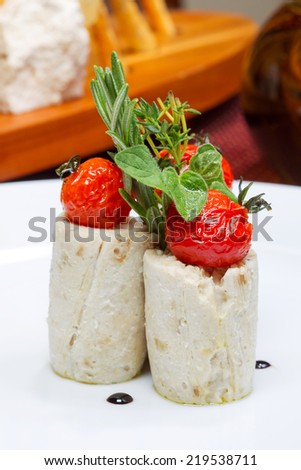 Mashed potatoes with pickled tomatoes with herbs, selective focus. Creative cuisine.