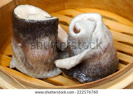 tableware, wood cup with a fish for a couple. Creative cuisine.