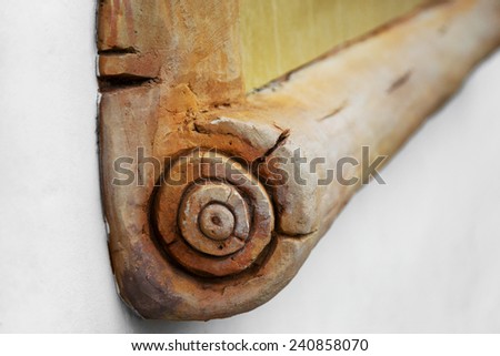 Decorative stone, sculpture in the form of an ancient scroll, decoration of the building. Selective focus with shallow depth of field for the creative art of stage design