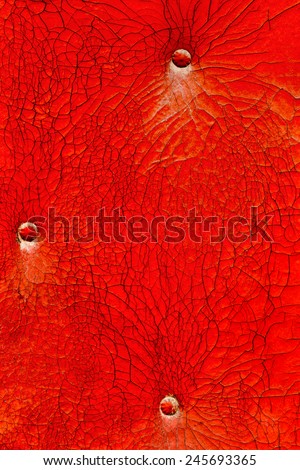 Abstract background of old coatings cracks and scratches the skin painted with red paint destroyed. For creative unusual vintage design